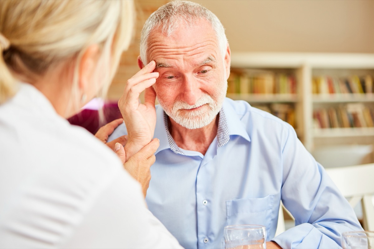 elderly man with dementia talking to the doctor